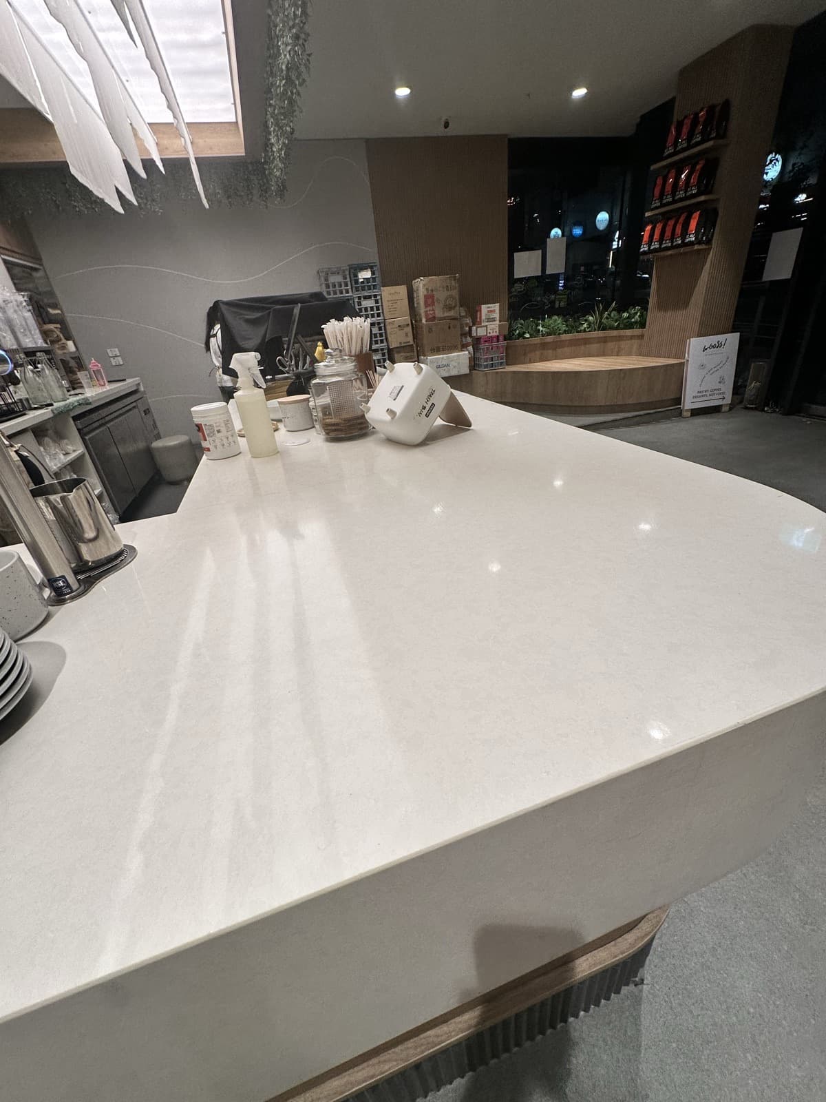 After: the white stone cafe counter edge with the chip filled and smoothed.