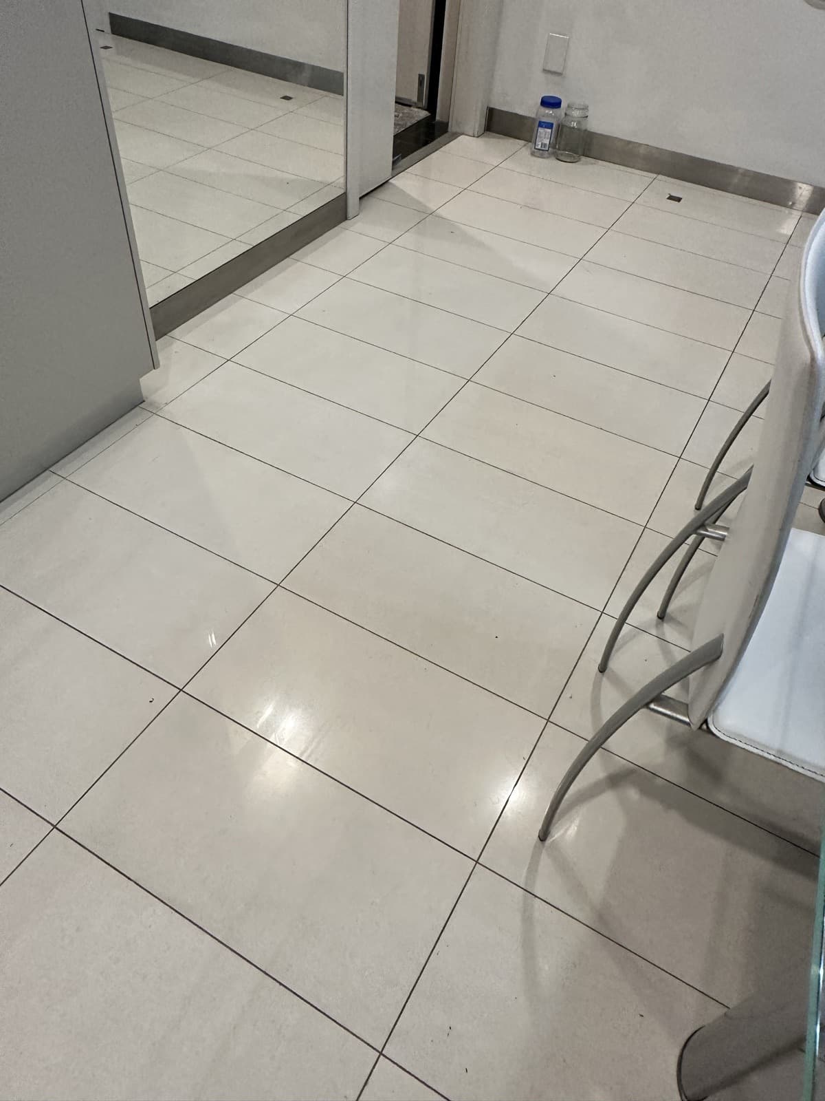After: the kitchen floor tile repaired and blended with the surrounding tiles.