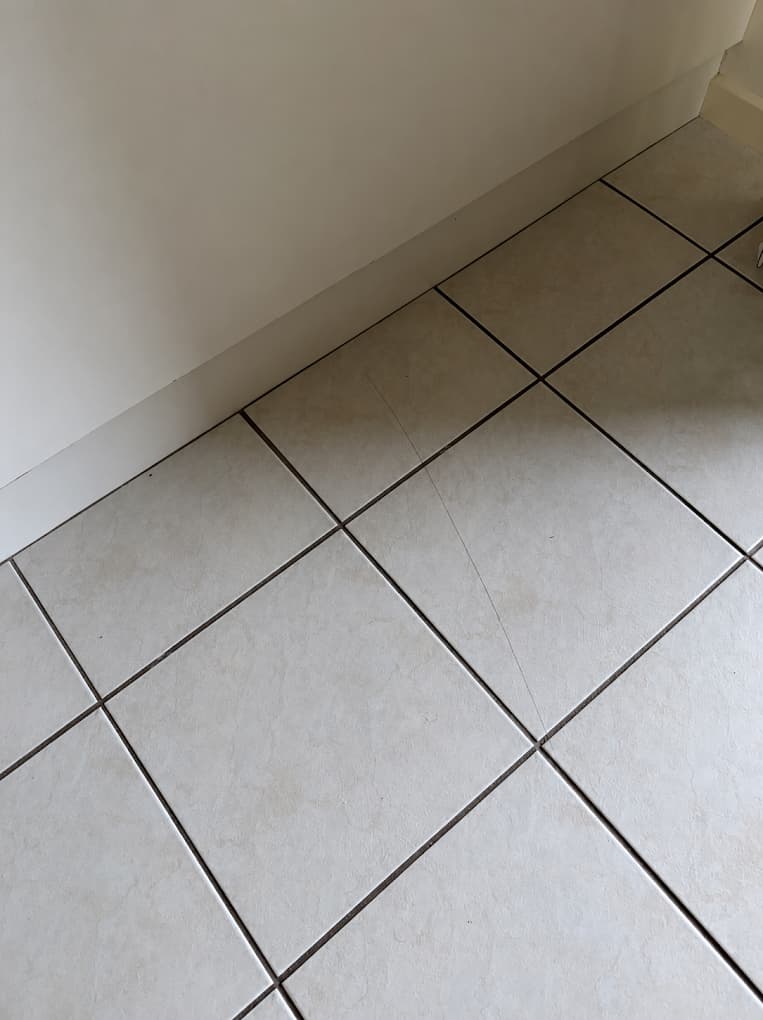 Repaired floor tiles, photographed for a customer review.